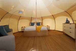 Glamping shot of bed in large tent